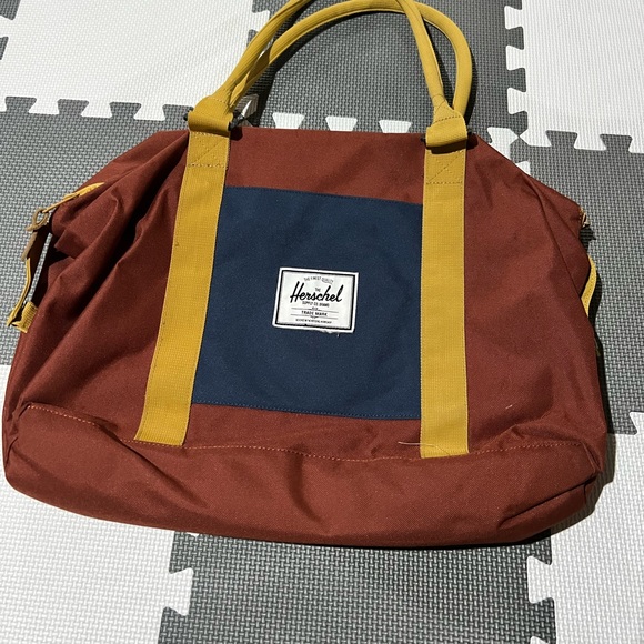 Herschel Supply Company Handbags - Herschel bag. Navy, mustard yellow and rust color.